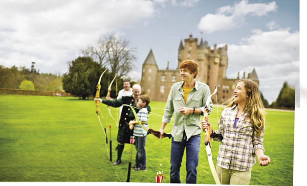 Tour participants try their hand at archery on the grounds of Glamis Castle