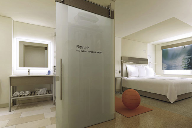 Minimalist and wellness-focused accommodations at EVEN Hotels.