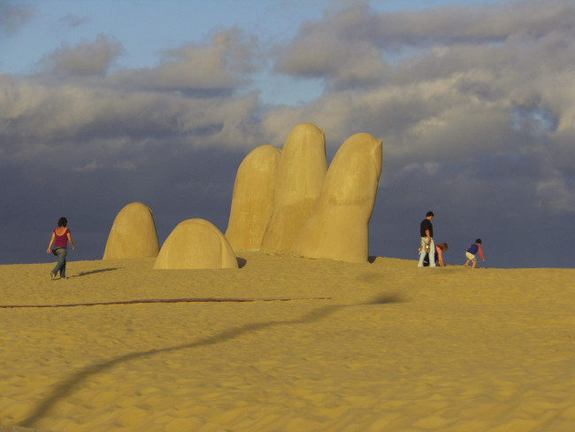 "The Hand in the Sand," by Mario Irarrazabal, has become the iconic artwork of Punta del Este, which clients visit on a Latin American Escapes tour.
