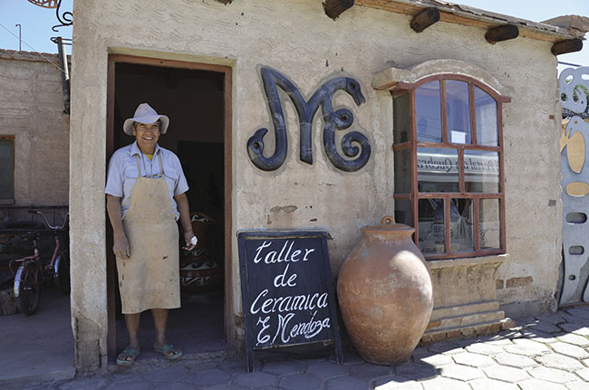 Visitors on Culture Xplorers’ Argentina: True North itinerary visit a ceramic workshop.