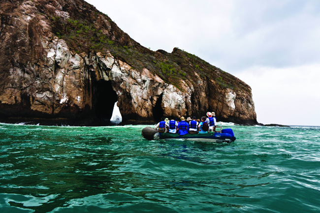 Ecoventura zodiac at Cerro Brujo, San Christobal in the Galapagos Islands,
