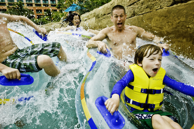A family on The Current at Atlantis Paradise Island.
