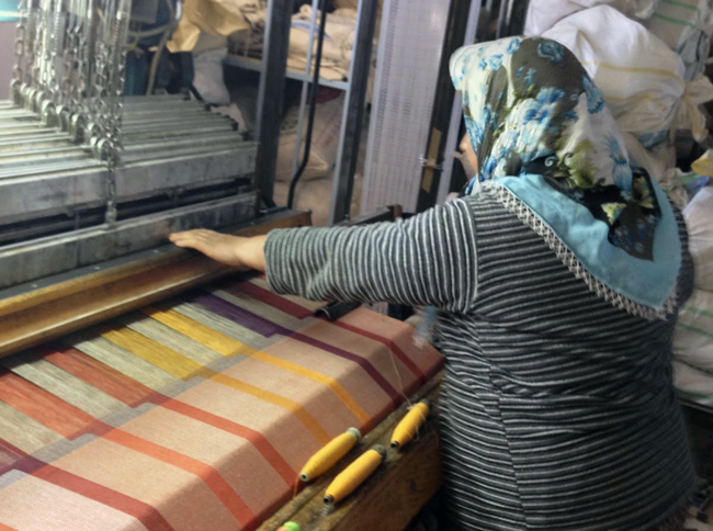 A weaver working on a Turkish towel.