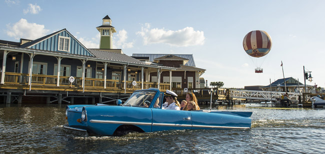 Guests go for a ride in a Captain-guided tour aboard an amphibious auto, known as an Amphicar, on Lake Buena Vista at Downtown Disney, as part of the waterfront adventures offered at The BOATHOUSE restaurant. The BOATHOUSE: Great Food, Waterfront Dining, Dream Boats, is a new upscale, waterfront dining experience in the heart of Downtown Disney with a gourmet menu featuring steaks, chops, fresh seafood and a raw bar. The BOATHOUSE from Schussler Creative is one of the new venues in The Landing, the first of four planned neighborhoods as Downtown Disney transitions to Disney Springs. Completion of Disney Springs is set for 2016. Downtown Disney is located at Walt Disney World Resort in Lake Buena Vista, Fla. (Matt Stroshane)