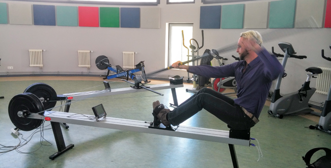 Olympic gold medalist Andreas Ihle showing a group of journalists how canoers train in the winter at the Sports Club Magdeburg.