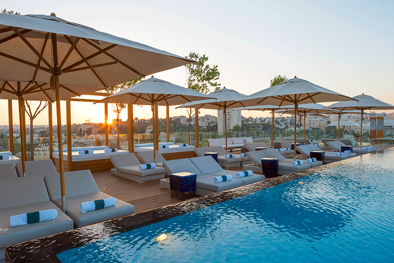 At the rooftop pool deck, guests can take in views of the Old City from the comfort of their cabanas.