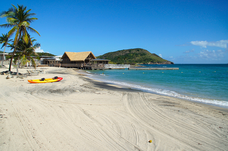 A nearly empty and tranquil beach awaits guests at the resort.