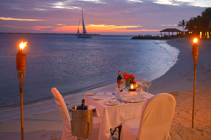 After a long day out on the water, guests at Harbour Village Beach Club can wind down with dinner on the beach.