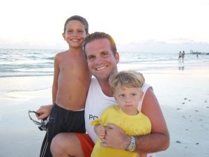 Frank enjoying a day at the beach with his sons Frankie Jr. (left) and Danny (right).