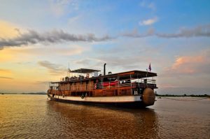 Guests enjoy a sail on the 10-cabin Mekong Riverboat. (Photo Courtesy of Grasshopper Adventures.)